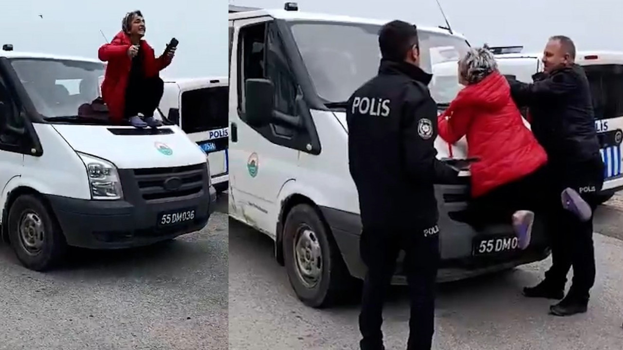 Belediye aracına tırmanan kadını polis güçlükle ikna etti