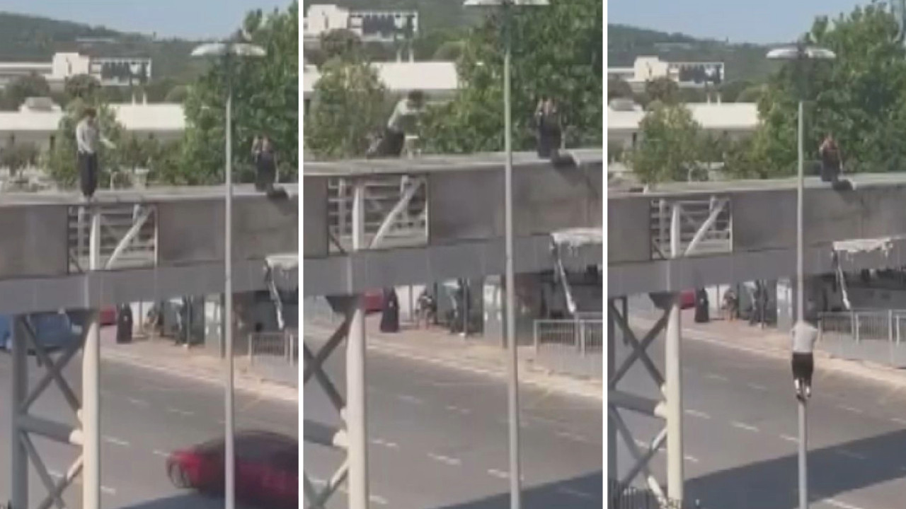 Görenler dondu kaldı: Üst geçitten direğe atlayıp kayarak indi