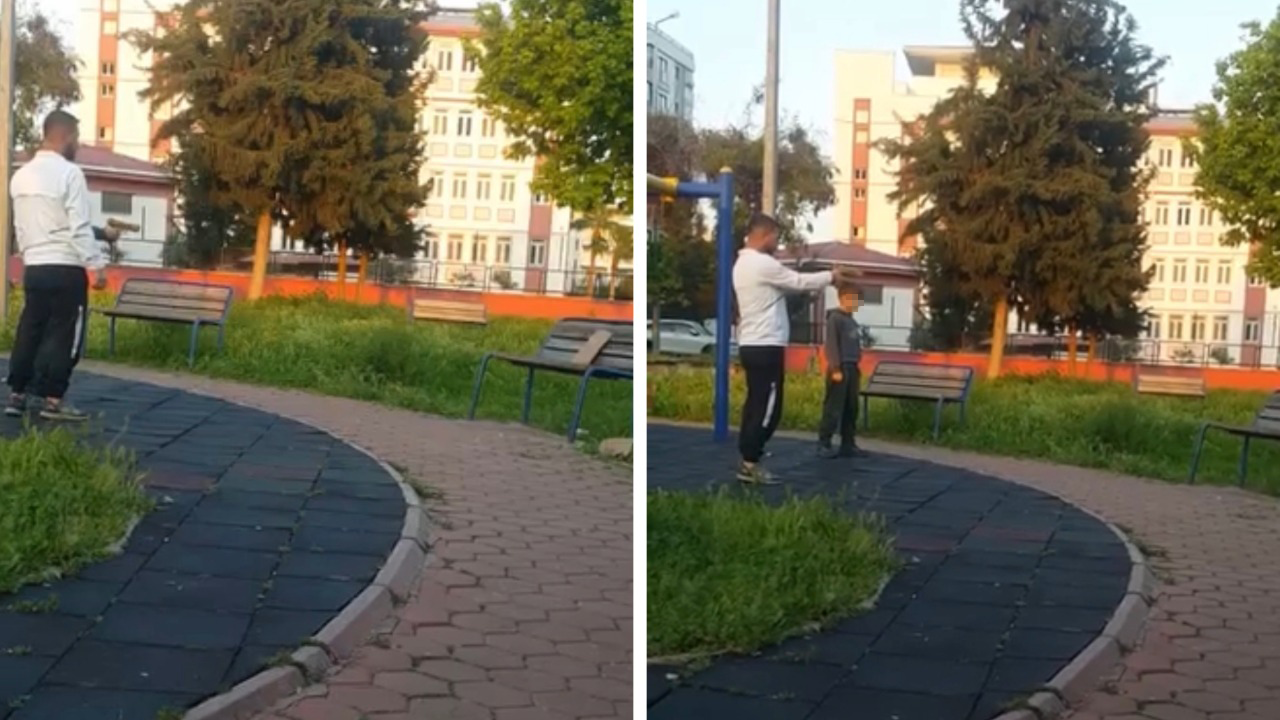 Parkta çocuğa oyuncak silahla atış talimi yaptırdı