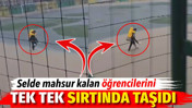 Selde mahsur kalan &ouml;ğrencilerini tek tek sırtında taşıdı