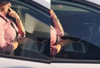 Kucağında bilgisayarla otomobil kullandı