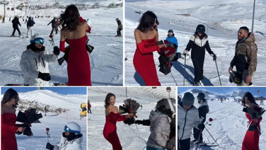 Kırmızı elbisesiyle Erciyes’te kayak yapıp, gül dağıttı