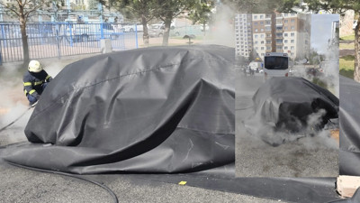 Yanan elektrikli otomobile battaniyeli müdahale