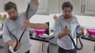 4 saat uğraştı... 2 metrelik yılanı çıplak elle yakaladı