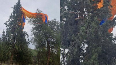Dinamit Tepesi'nden uçtu ağaçta asılı kaldı