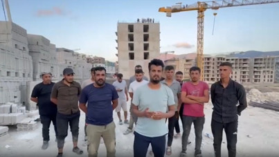 Deprem konutlarında eylem: İşçiler çatıya çıktı