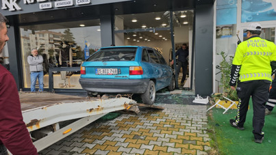 Mağazaya giren otomobilin ardından kavga çıktı. Baba ve kızı yaralandı