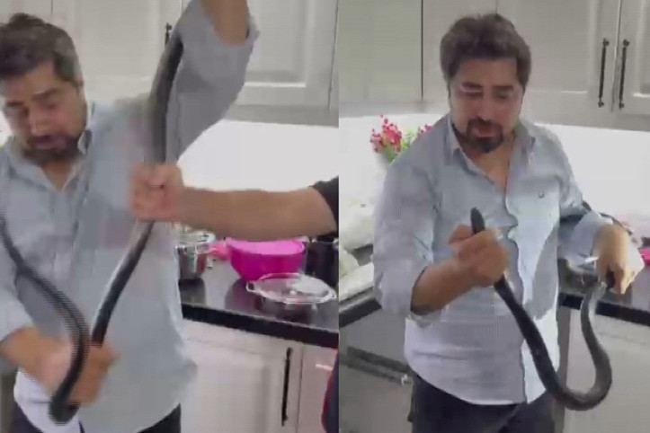 4 saat uğraştı... 2 metrelik yılanı çıplak elle yakaladı