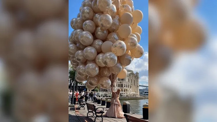 Uçan balonlar kadını götürüyordu. Fotoğrafçı havada kaptı - Resim : 1