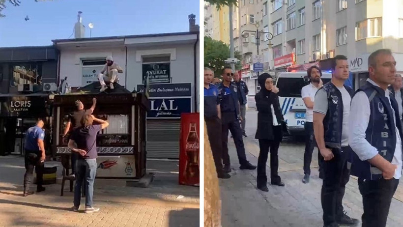 Büfesini kurtarmak için çatıya çıktı, kendini zincirledi - Resim : 1